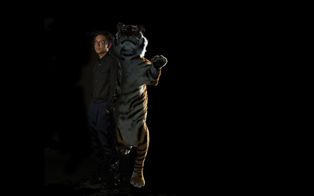 Ho Tzu Nyen next to a fake tiger